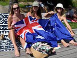 Millions of Australians hit beach to celebrate national day while Indigenous protesters hold marches