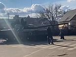 Ukraine’s SECOND Tiananmen moment: Local man climbs on top of Russian tank