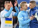 Ukrainian duo Oleksandr Zinchenko and Vitaliy Mykolenko embrace each other before Everton-Man City