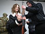 Children and women are taught how to fire machine guns and strip an AK-47 in Ukraine