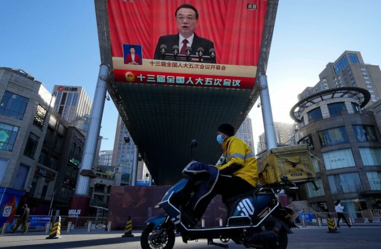 China cuts economic growth goal as it tries to reverse slump