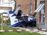 Small plane crashes into a block of flats in Oxfordshire as pilot is hospitalised