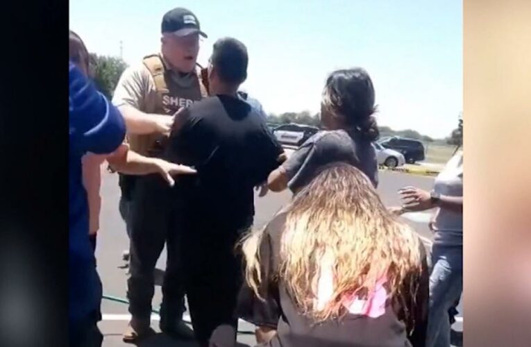 Parents seen frustrated with police at shooting scene in new video