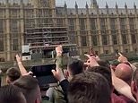 ‘We can see you watching porn!’: Luton fans sing to Neil Parish as they sail past Parliament