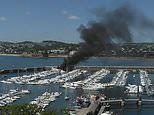 Superyacht worth £6m with 8,000 litres of fuel onboard goes up in flames in Devon harbour