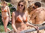 Elizabeth Olsen shows off her toned form while packing on the PDA with her husband Robbie Arnett