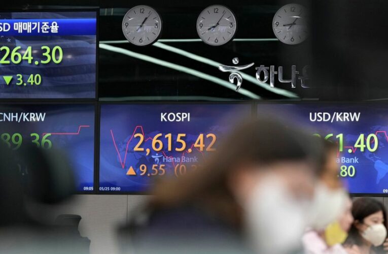 Asian stocks mixed after Fed confirms rate hike plans