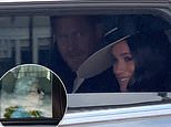 Prince Harry and Meghan roll down car window and beam at crowds