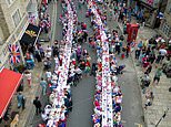Now THAT’S a street party! Neighbours fill road with tables for Platinum Jubilee street parties