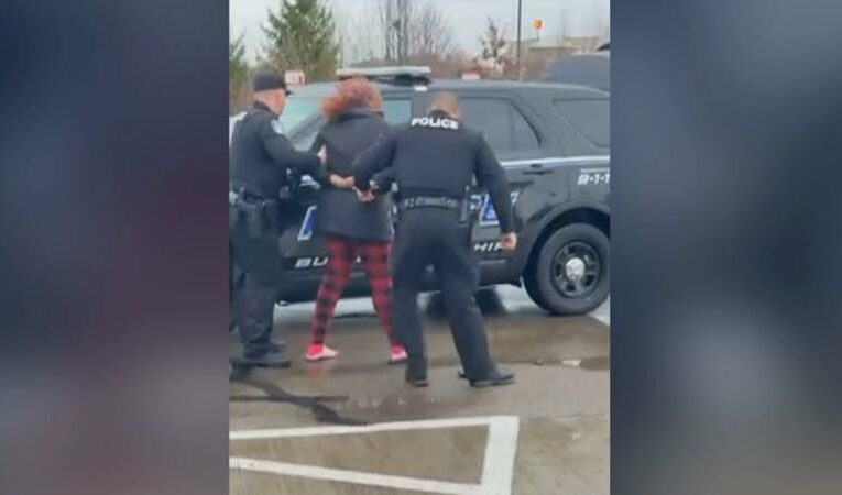 2 Ohio police officers are under investigation after video shows one punching a woman in the face outside a McDonald’s | CNN